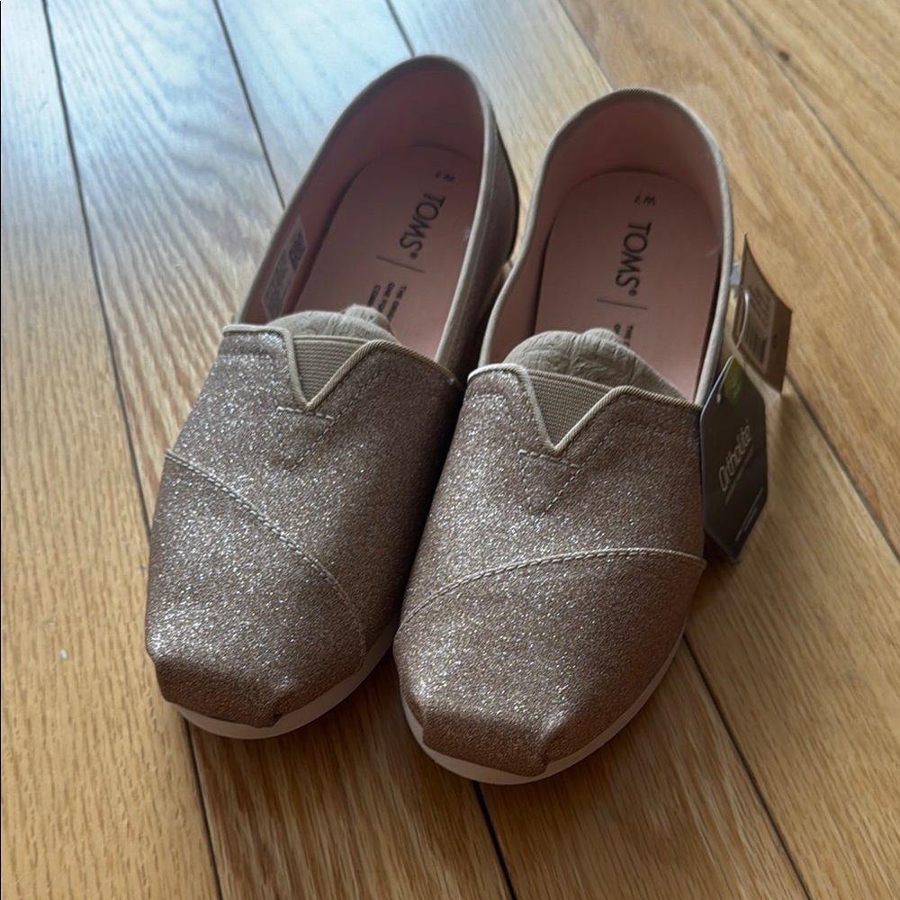 Toms Champagne Glitter Slippers with Classic Slip-On Design